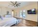 Serene main bedroom showcases a decorative dresser, and French doors that leads to a private outdoor area at 5225 S Opal Pl, Chandler, AZ 85249