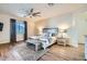 Spacious main bedroom offers a cozy retreat with a plush rug, a stylish ceiling fan, and a king-size bed at 5225 S Opal Pl, Chandler, AZ 85249