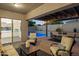 Covered patio with stylish furniture and a view of the sparkling pool and landscaped backyard at 5225 S Opal Pl, Chandler, AZ 85249