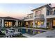 Stunning backyard featuring a pool, elegant patio, and beautifully landscaped gardens at 5915 E Calle Del Sud --, Phoenix, AZ 85018
