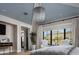 Light-filled bedroom features a stunning mountain view, modern lighting, and stylish decor at 5915 E Calle Del Sud --, Phoenix, AZ 85018