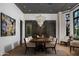 Elegant dining room with a large chandelier, wine storage, and seating for eight at 5915 E Calle Del Sud --, Phoenix, AZ 85018
