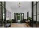 Bright entryway with black trim, hardwood floors, and a view to the backyard at 5915 E Calle Del Sud --, Phoenix, AZ 85018