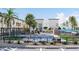 Relaxing community pool area with lounge chairs, mature trees, and well-maintained landscaping at 651 N Ironwood Dr # 2, Apache Junction, AZ 85120