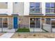 A modern townhouse with a bright blue front door and balcony at 651 N Ironwood Dr # 2, Apache Junction, AZ 85120