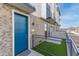 Beautiful townhouse with a blue door, turf lawn, and metal railing at 651 N Ironwood Dr # 2, Apache Junction, AZ 85120