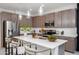 Bright kitchen featuring stainless steel appliances, island seating, and modern cabinetry at 651 N Ironwood Dr # 2, Apache Junction, AZ 85120