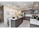 Modern kitchen featuring an island with seating, stainless steel appliances, and ample cabinet space at 651 N Ironwood Dr # 2, Apache Junction, AZ 85120