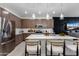 Spacious kitchen featuring island seating, stainless steel appliances, and modern cabinetry at 651 N Ironwood Dr # 2, Apache Junction, AZ 85120