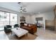 Cozy living room with modern furnishings, a ceiling fan, and plenty of natural light at 651 N Ironwood Dr # 2, Apache Junction, AZ 85120