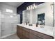 A modern bathroom with a dual sink vanity, large shower, and stylish fixtures at 651 N Ironwood Dr # 3, Apache Junction, AZ 85120