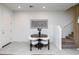 Cozy dining area with modern decor, adjacent to staircase at 651 N Ironwood Dr # 3, Apache Junction, AZ 85120