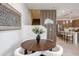 Stylish dining area with a unique table and a view of the staircase at 651 N Ironwood Dr # 3, Apache Junction, AZ 85120