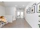 Upstairs hallway with carpeting, a small display area, and doorways to bedrooms and bathrooms at 651 N Ironwood Dr # 3, Apache Junction, AZ 85120