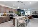 Bright kitchen featuring a spacious island with seating and a view of the living area at 651 N Ironwood Dr # 3, Apache Junction, AZ 85120