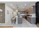 Contemporary kitchen featuring a large island with seating and stainless steel appliances at 651 N Ironwood Dr # 3, Apache Junction, AZ 85120