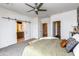 This is the main bedroom with white walls, white sliding door and a ensuite bathroom at 651 N Ironwood Dr # 3, Apache Junction, AZ 85120
