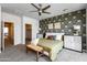 Beautiful main bedroom with patterned wall, ceiling fan, and natural light, creating a serene space at 651 N Ironwood Dr # 3, Apache Junction, AZ 85120