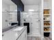 Stylish bathroom features a modern vanity with gray countertop and a glass-enclosed walk-in shower at 651 N Ironwood Dr # 4, Apache Junction, AZ 85120