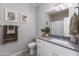 Bathroom with a vanity and a framed mirror, along with decoratively framed art hung on the walls at 651 N Ironwood Dr # 4, Apache Junction, AZ 85120