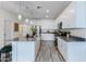 Spacious kitchen with white cabinets, stainless steel appliances, and ample counter space at 651 N Ironwood Dr # 4, Apache Junction, AZ 85120