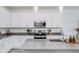 Well-lit kitchen featuring stainless steel appliances, ample counter space, and neutral color palette at 651 N Ironwood Dr # 4, Apache Junction, AZ 85120