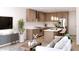 Open living space featuring modern kitchen with stainless steel appliances and cozy seating area at 651 N Ironwood Dr # 4, Apache Junction, AZ 85120