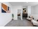 Bright loft area with modern decor, neutral carpet, and natural light from a nearby window at 651 N Ironwood Dr # 4, Apache Junction, AZ 85120