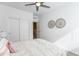 Bright bedroom with a ceiling fan, decor, and sliding closet doors at 651 N Ironwood Dr # 7, Apache Junction, AZ 85120