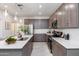 Modern kitchen boasts stainless steel appliances, stone countertops, and stylish undermount sink at 651 N Ironwood Dr # 7, Apache Junction, AZ 85120