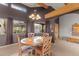 Charming dining area with wooden table, exposed beams and natural light, creating inviting space at 669 W Chaparral Rd, Wickenburg, AZ 85390