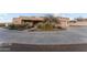 Spacious circular driveway leading to the house with desert landscaping, and views of the surroundings at 669 W Chaparral Rd, Wickenburg, AZ 85390