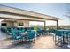 Expansive roof deck features outdoor dining, a TV, and panoramic city and mountain views at 7120 E Kierland Blvd # 410, Scottsdale, AZ 85254