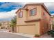 Two-story home featuring a two-car garage, tiled roof, and light-colored stucco at 7172 S 48Th Gln, Laveen, AZ 85339