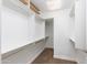 Spacious walk-in closet with custom shelving and ample storage space at 7175 E Camelback Rd # 307, Scottsdale, AZ 85251