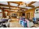 Resident lounge showcasing wood beams, a chandelier, bar, and stylish seating areas for socializing and entertaining at 7175 E Camelback Rd # 307, Scottsdale, AZ 85251