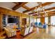 Inviting resident lounge with wood paneling, a fireplace, TV, and ample seating for relaxation and social activities at 7175 E Camelback Rd # 307, Scottsdale, AZ 85251
