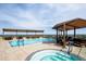 Beautiful rooftop pool and hot tub area with covered lounge seating at 7175 E Camelback Rd # 307, Scottsdale, AZ 85251