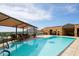 Luxury rooftop pool and lounge area with views of surrounding cityscape and mountains at 7175 E Camelback Rd # 307, Scottsdale, AZ 85251