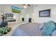 Angle view of a bedroom with high ceilings and an entertainment center in a well lit home at 7272 E Gainey Ranch Rd # 27, Scottsdale, AZ 85258