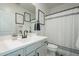 Stylish bathroom featuring a vanity with black hardware, and a shower with decorative black and white accents at 778 E Harper St # 101, Gilbert, AZ 85297