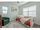 Bright bedroom featuring a daybed, large windows, neutral paint, and modern decor at 778 E Harper St # 101, Gilbert, AZ 85297