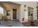 Inviting covered front porch with a rocking chair, and decorative elements. Home number clearly displayed for easy identification at 778 E Harper St # 101, Gilbert, AZ 85297