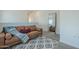 Comfortable living room with modern furnishings, rug, and a large mirror reflecting the space at 778 E Harper St # 101, Gilbert, AZ 85297