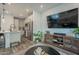 Open living space with a view of the kitchen and a media console, creating an inviting and connected atmosphere at 778 E Harper St # 101, Gilbert, AZ 85297