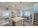 Open-concept living space with kitchen island, dining area and comfortable living room, perfect for modern living at 778 E Harper St # 101, Gilbert, AZ 85297