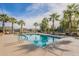 Community pool featuring lounge chairs, palm trees, and blue skies at 778 E Harper St # 101, Gilbert, AZ 85297