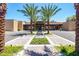 Stunning clubhouse entrance framed by stately palm trees and professional landscaping at 7878 E Gainey Ranch Rd # 57, Scottsdale, AZ 85258