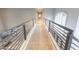 Upstairs hallway with carpet floors and rod iron railing at 7878 E Gainey Ranch Rd # 57, Scottsdale, AZ 85258