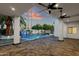Stunning backyard with a sparkling pool, a tranquil waterfall, and a well-designed patio at 8713 N 80Th Pl, Scottsdale, AZ 85258